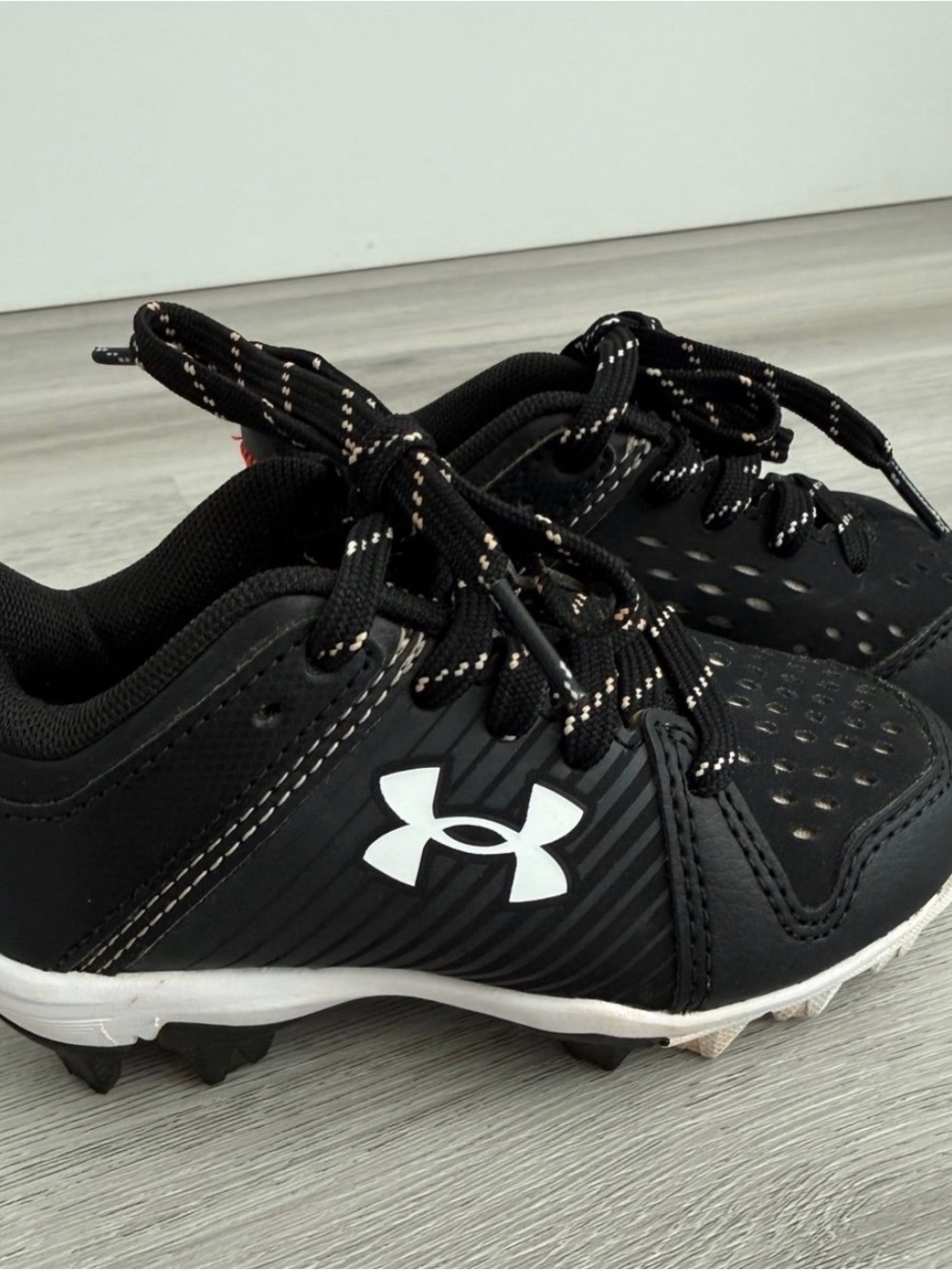 Under Armour Kids Black and White Athletic Cleats